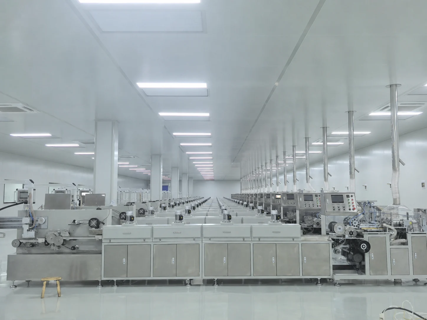 Rows of automated cotton swab production lines in the SwabMasters controlled clean workshop